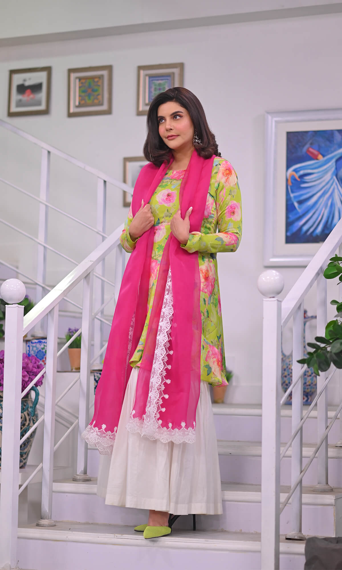 Floral Shirt paired with a white gharara and pink dupatta