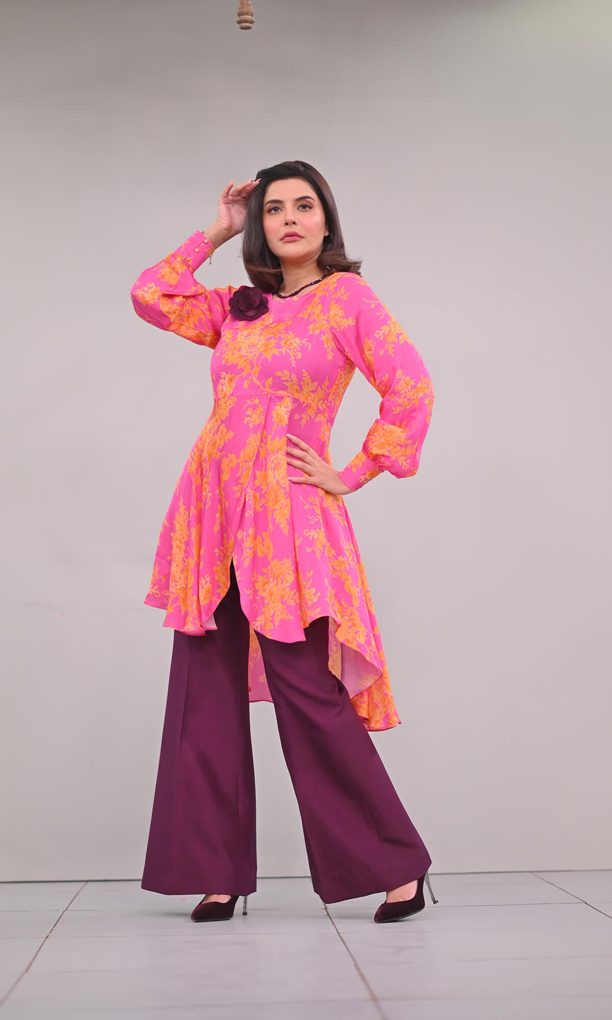 printed peplum top paired with pure raw silk boot pants
